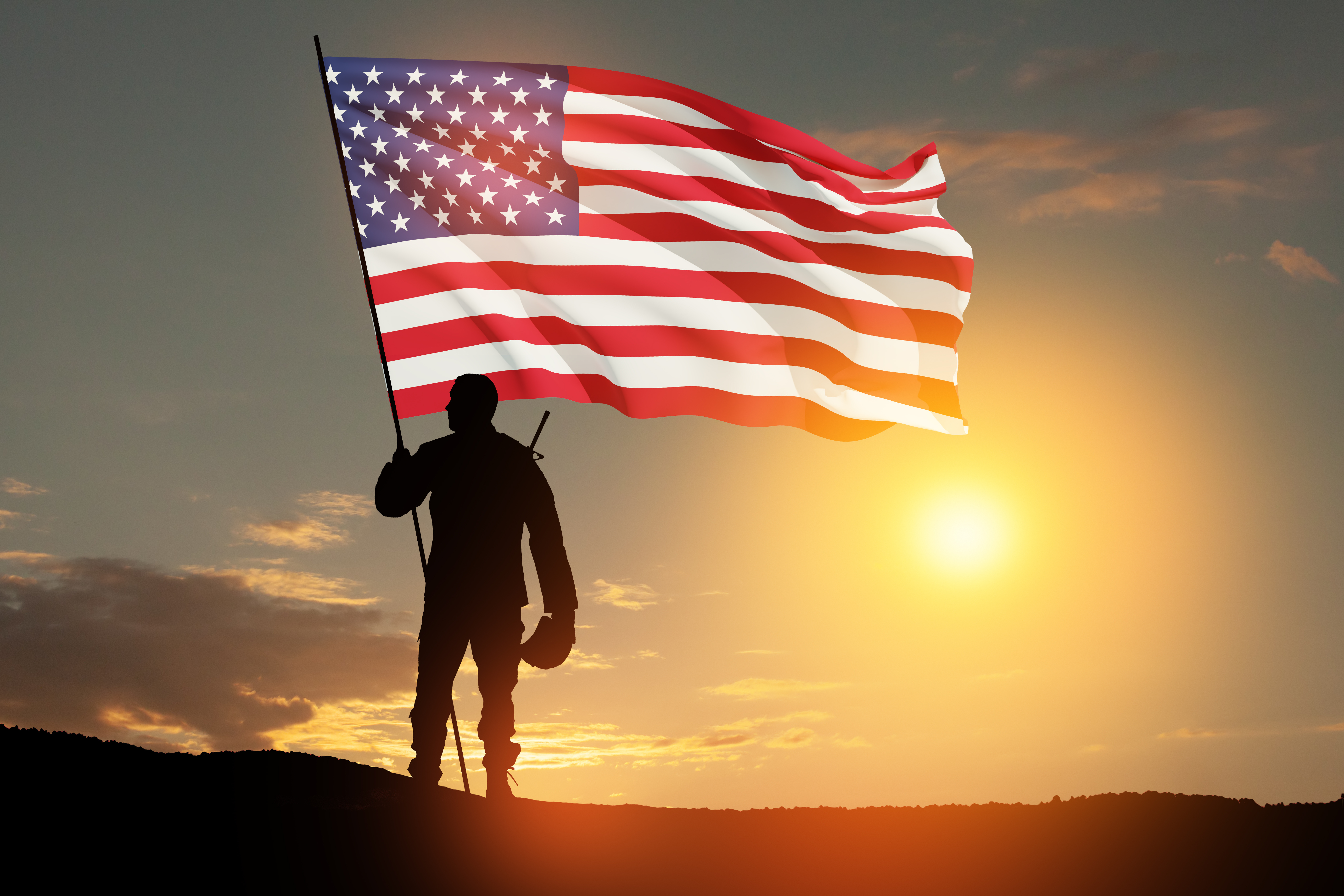 An image of a Navy veteran standing in front of the American flag.