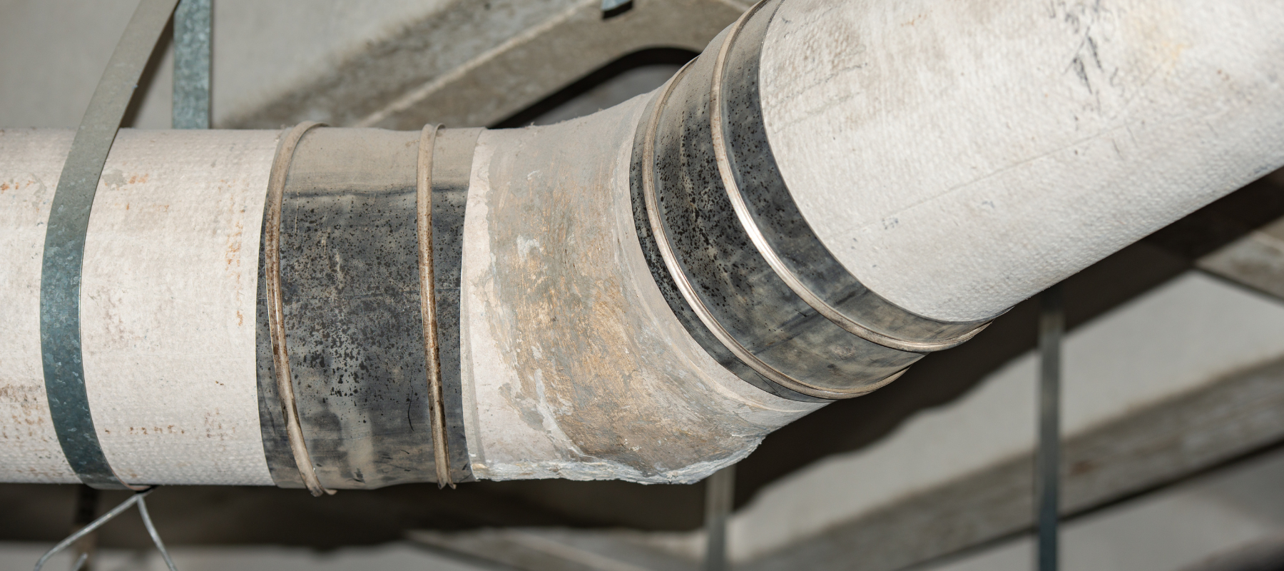 An asbestos pipe used for a gas line in a building