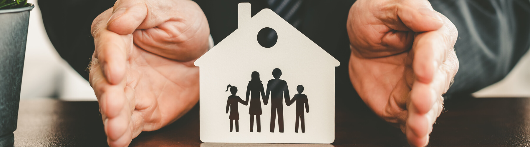 home icon with a family in it, indicating a safe home 