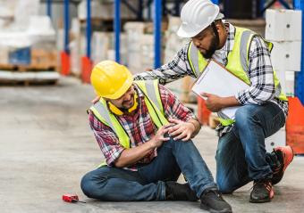 An image of a man who is hurt thinking, “I’m injured at work, can I sue?”